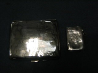 A silver vesta case with engine turned decoration, Birmingham 1913 and a silver cigarette case Chester,