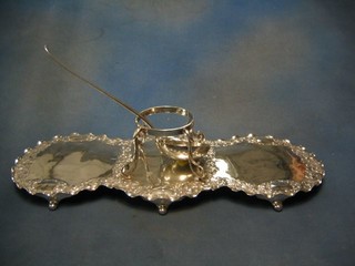 A 19th Century embossed silver plated table centre piece incorporating stand to the centre and a silver plated Old English pattern sauce ladle