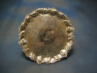 A George III silver salver with later engraved decoration and bracketed border, the centre with armorial decoration, the reverse with inscription, London 1829 13", 39 ozs