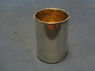 A Georgian silver beaker with parcel gilt interior, marks rubbed