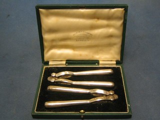 2 pairs of silver plated nut crackers, cased