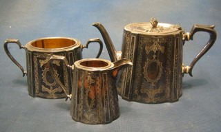 An engraved Britannia metal 3 piece tea service with teapot, cream jug and twin handled sugar bowl