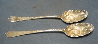 A pair of Antique silver bottom marked berry spoons