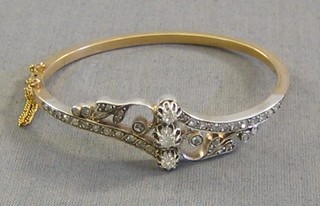A lady's 18ct gold and silver bangle, set 41 diamonds