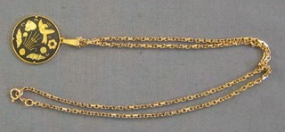 A lady's gold chain hung a gilt metal pendant