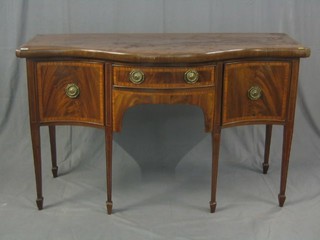 A 19th Century mahogany serpentine fronted sideboard,  fitted 1 drawer flanked by a pair of cupboards, raised on square tapering supports ending in spade feet 54"