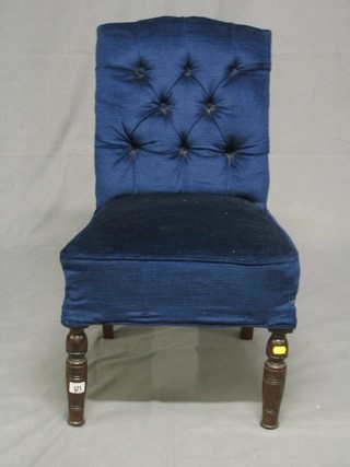 A Victorian mahogany framed nursing chair upholstered blue buttoned material, on turned supports