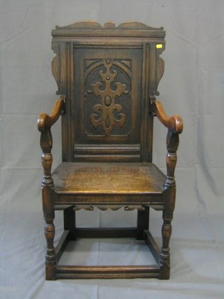 A 19th/20th Century carved oak Wainscot chair, on turned and block supports