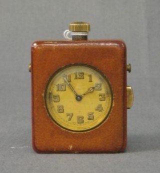 A 1930's repeating, striking travelling clock contained in a leather case 2 1/2"