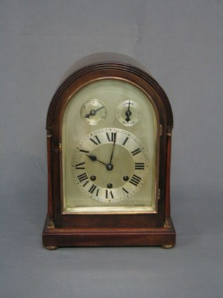 An Edwardian chiming bracket clock with arch shaped silvered dial, slow/fast indicator, silent/chime indicator, contained in a mahogany arched case, raised on bun feet