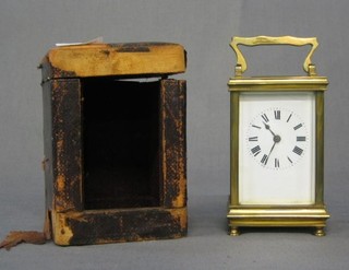 A 19th Century 8 day carriage clock complete with leather carrying case