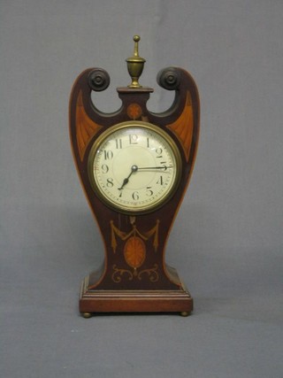 An Edwardian French 8 day bedroom timepiece with enamelled dial contained in a shaped inlaid mahogany case