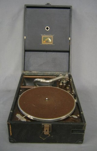 An HMV manual gramophone contained in a black fibre carrying case