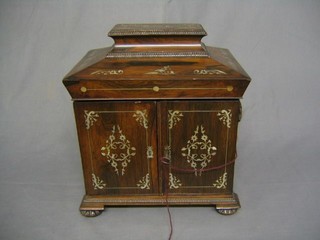 A William IV inlaid rosewood work box of sarcophagus form inlaid mother of pearl with hinged lid, the interior fitted 3 drawers, raised on reeded bun supports 12"