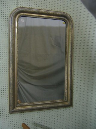 A 19th Century D shaped mirror, contained in a silvered frame 28"