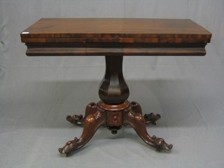 A Victorian mahogany card table, raised on  bulbous turned column and tripod supports 38"