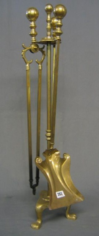 A brass 3 piece fireside companion set with poker, tongs and shovel