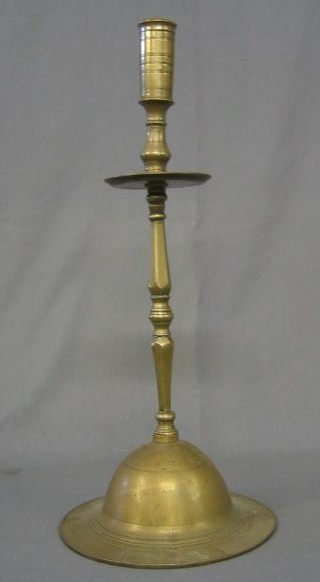 A 17th Century style brass candlestick 23"