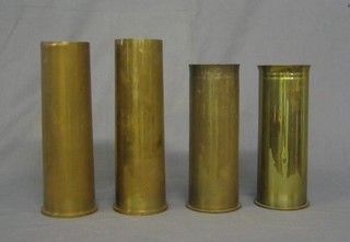 A pair of 6lb brass shell cases and a pair of WWI Continental shell cases (4)