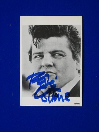 A signed black and white photograph of Robbie Coltrane