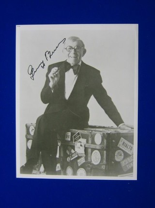 A signed black and white photograph of George Burns