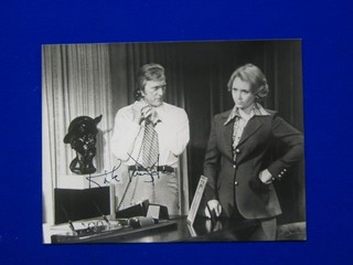 A signed black and white photograph of Kirk Douglas