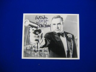 A signed black and white photograph of Sean Connery as James Bond in Diamonds Are Forever