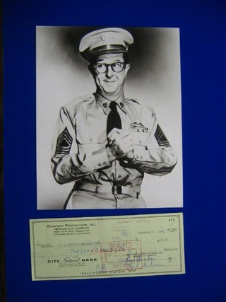 A cheque dated November 7 1963, signed by Phil Silvers for $46.34 together with a black and white photograph of Phil Silvers as Sgt. Bilko