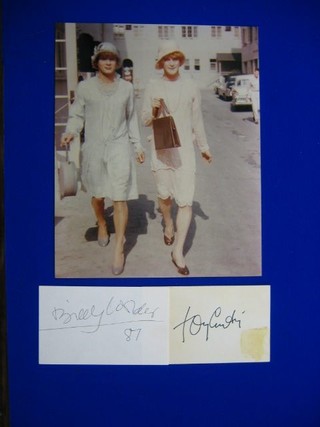 A colour still from the film Some Like it Hot, together with a  slip of paper signed by Tony Curtis and a slip  of paper signed by the Directory Billy Wilder dated '87