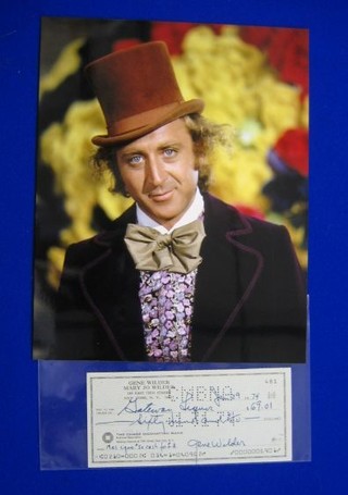 A cheque dated Jan 29 1974 to Gateway Liquor for $69.0 signed by Gene Wilder together with a photograph