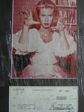 A colour photograph of Elizabeth Montgomery from "Bewitched" mounted with a 1978 signed cheque