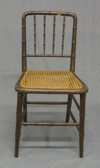 A  set of 4 bamboo stick and rail back dining chairs with woven cane seats
