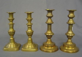 2 pairs of brass candlesticks with ejectors 9"