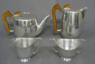 A 4 piece Picquot stainless steel tea service comprising teapot, hotwater jug, cream jug and sugar bowl