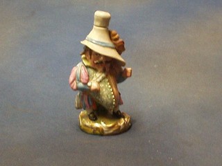 A 19th Century Continental porcelain scent bottle in the form of a standing Sir John Falstaff (the base marked JP) 6"