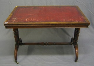 A Victorian walnutwood library table with inset tooled leather writing surface, raised on 4 turned columns with H framed stretcher by James Winter of 101 Wardour St, London, 39"