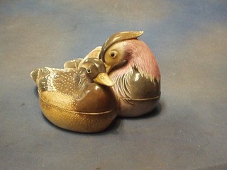A 19th Century Oriental porcelain twin section egg store in the form of 2 seated ducks 9"