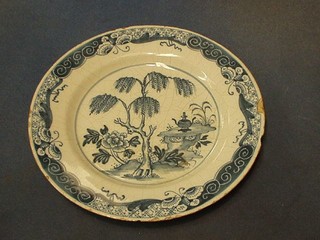 An 18th/19th Century Delft pottery plate decorated a blue and white tree (some chips to rim) 9 1/2"