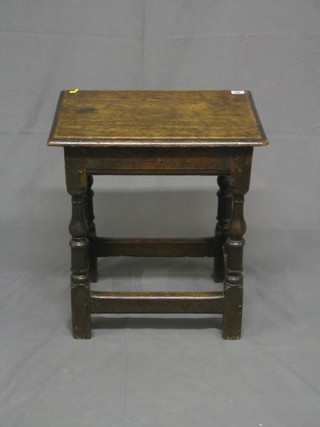 A rectangular oak joyned stool raised on turned and block supports 19"