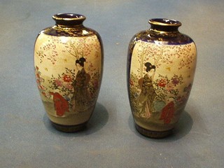 A pair of late 19th Century Japanese Satsuma porcelain vases with panelled decoration, decorated court figures, the base with seal mark 6 1/2"