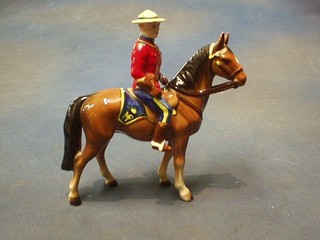 A Japanese figure of a  Canadian mounted Policeman 7 1/2"