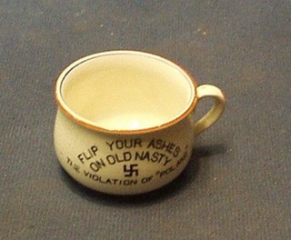 A Fieldings miniature pottery jam pot, the interior decorated Hitler and marked "Flick Your Ash on Old Nazi, The Violation of Poland", 2"