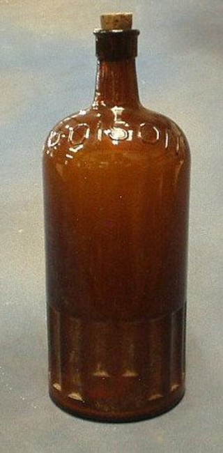 A large brown glass bottle marked Poison 13"