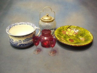 A 19th Century cranberry glass jug with clear glass handle 5", 2 cranberry glass wine glasses with clear glass stems, a cut glass biscuit barrel with silver plated lid, German hand painted plate and a Copeland Spode chamber pot (cracked)