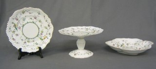 A 17 piece Crown Staffordshire dessert service comprising 2 comports, 2 shaped dishes (cracked), 2 12" oval dishes (1 cracked), 11 plates (1 cracked, 1 chipped) purchased at James Shoolbred & Co