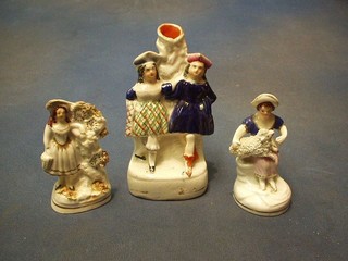 A 19th Century Staffordshire spill vase boy and girl 6", a Staffordshire figure of a shepherd and lamb and a Staffordshire figure of a standing girl 4" (f)