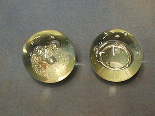A pair of bubble glass paperweights 2"