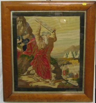 A Victorian Berlin woolwork panel "Moses Bringing the Ten Commandments Down From Mount Sinai" contained in a maple  frame 21" x 18"
