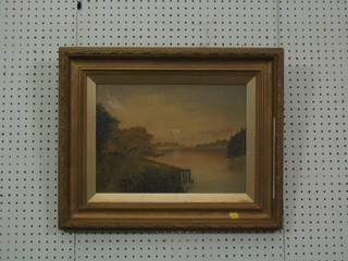 A 19th Century oil painting on canvas "River with Bridge and Setting Sun" 10" x 14" in a decorative gilt frame