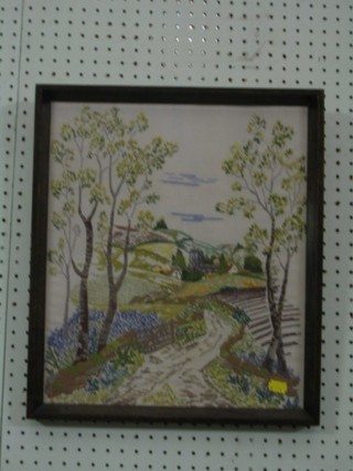 A 1930's wool work picture "Country Lane with Church and Cottages" 16" x 14"